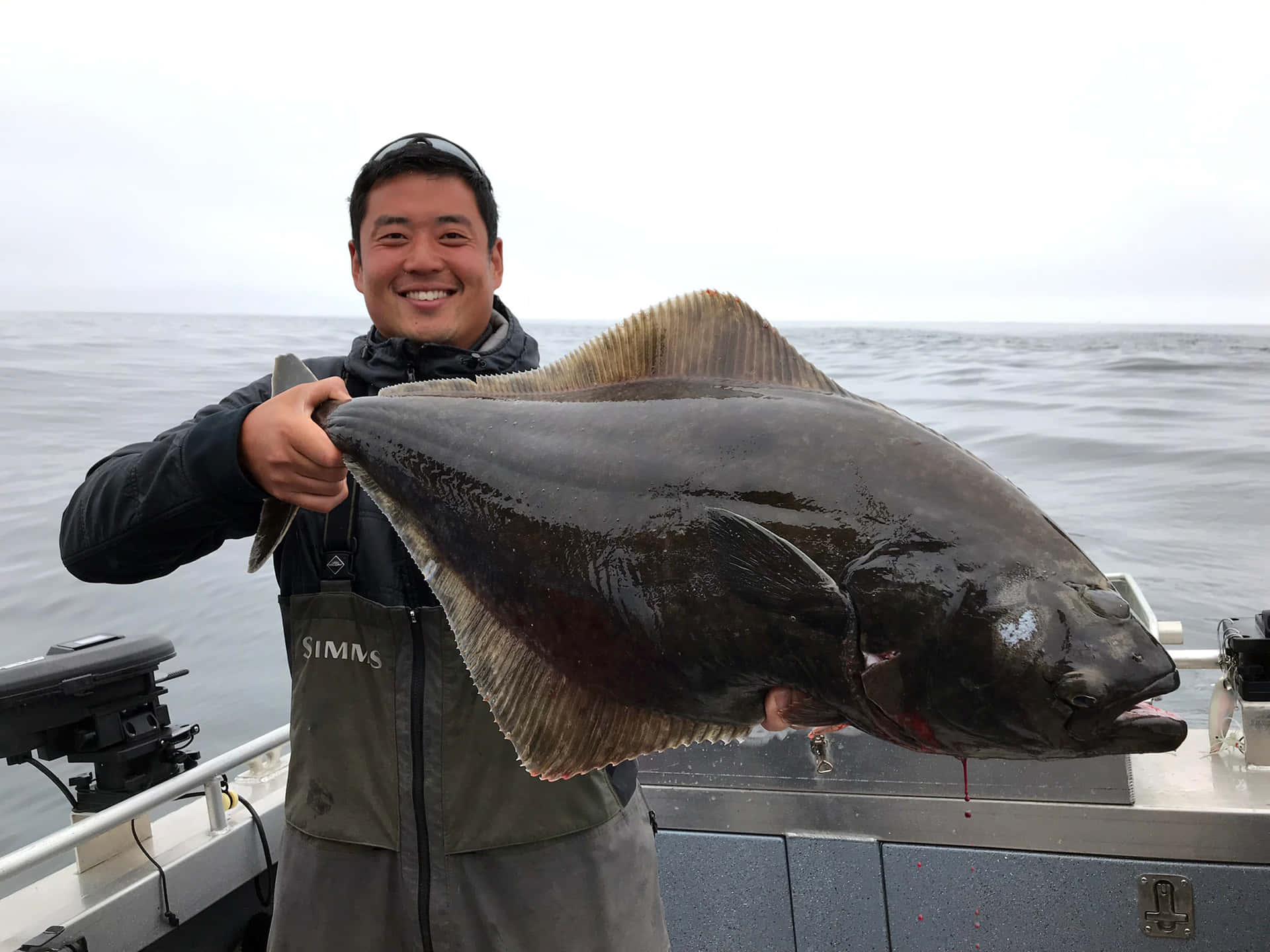 Happy Fishermanwith Large Halibut