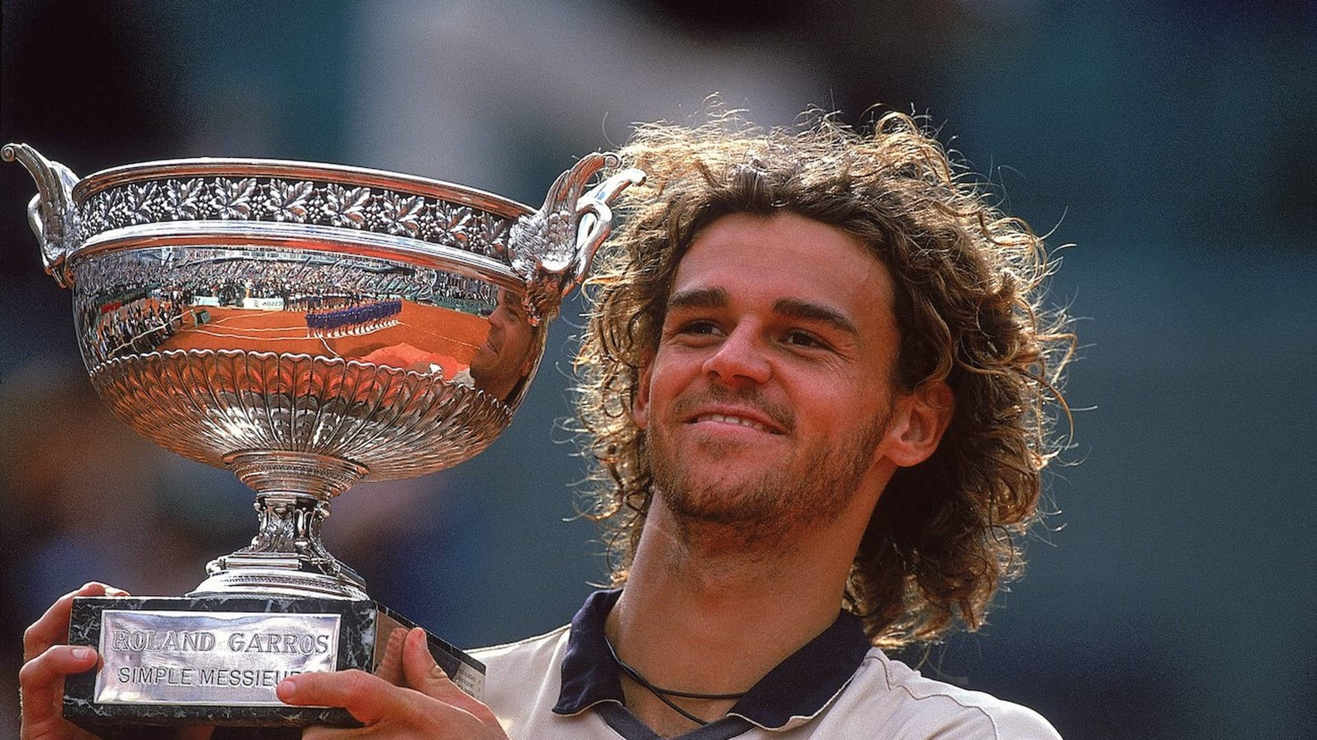 Happy Gustavo Kuerten With His Trophy Background