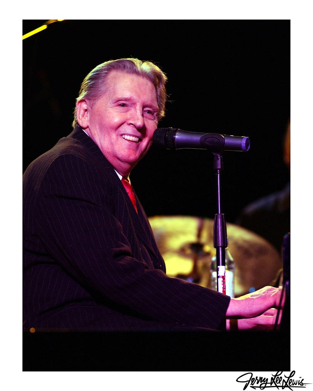 Happy Jerry Lee Lewis On Stage Background