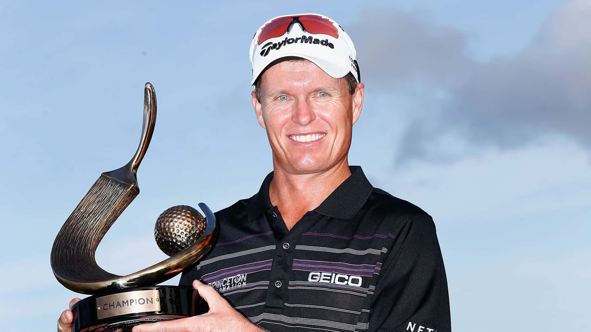 Happy John Senden Holding A Trophy Background