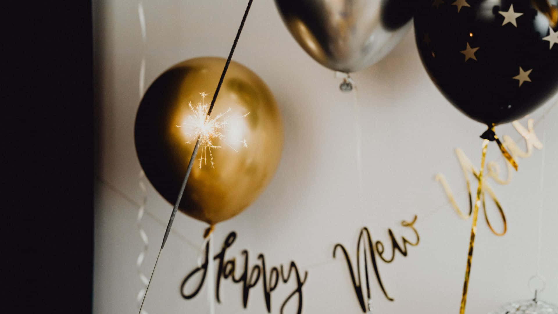 Happy New Year Balloons With Gold And Silver Letters Background