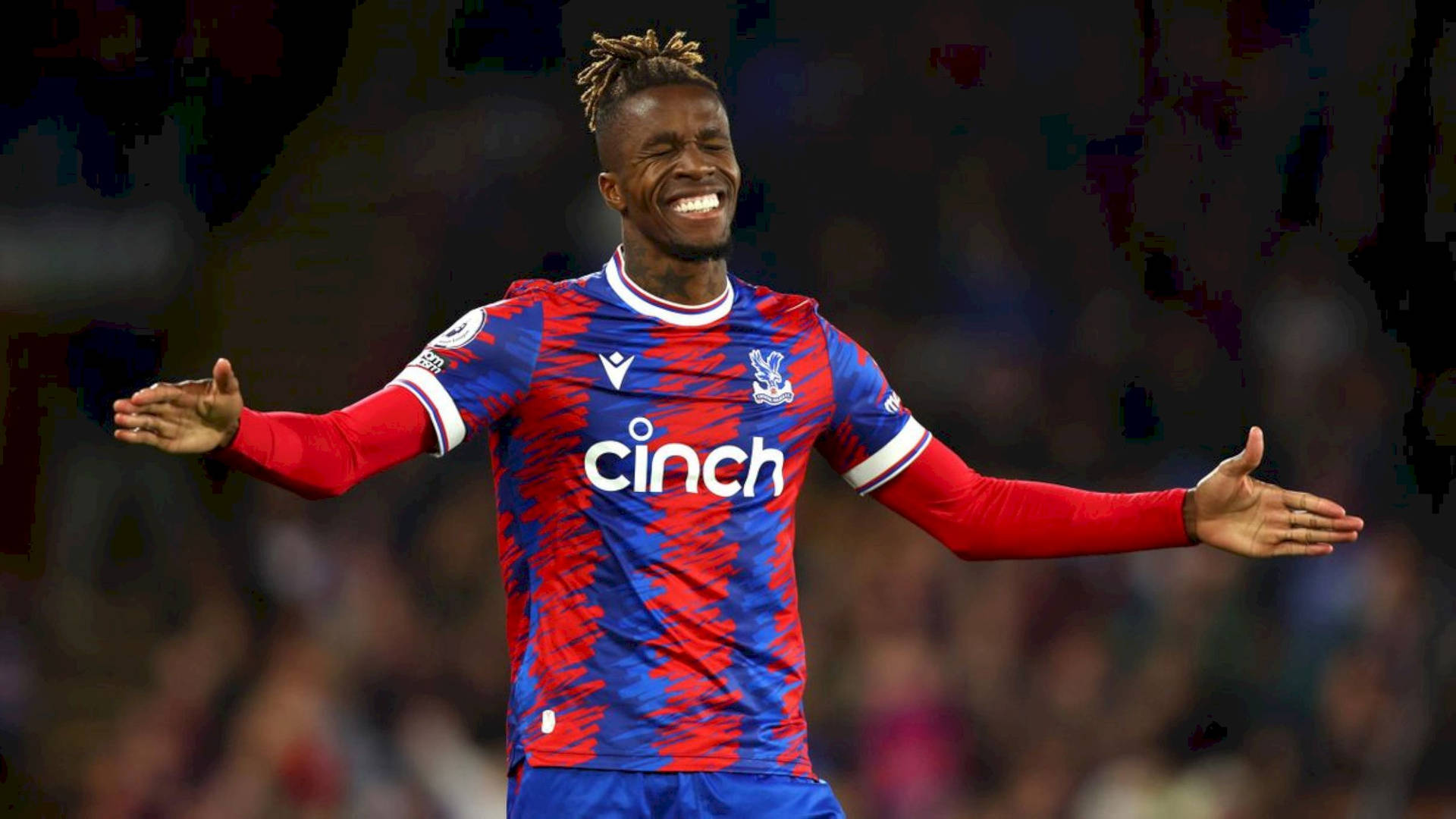 Happy Wilfried Zaha With Arms Spread Background