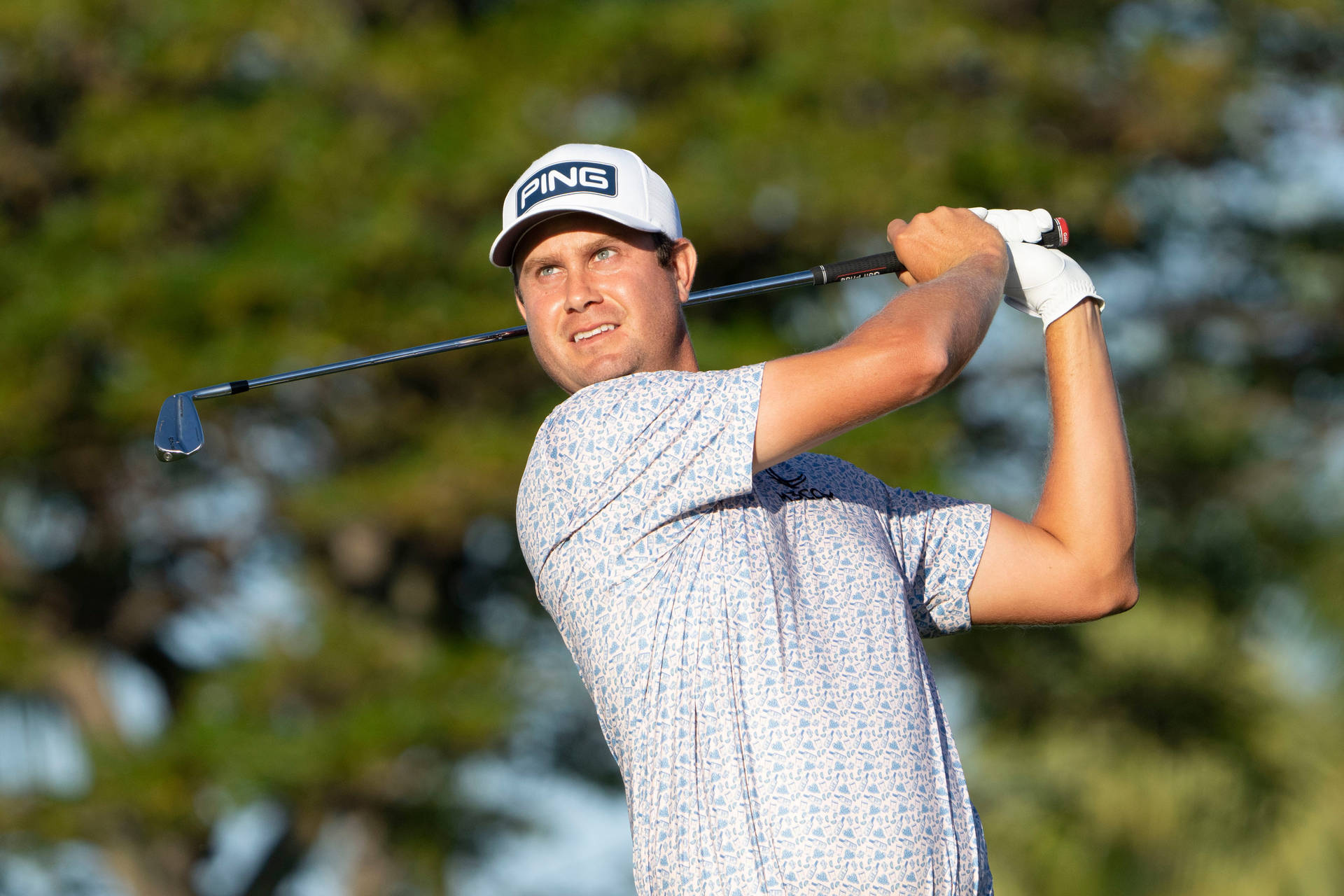 Harris English Eyes His Shot On The Golf Course Background