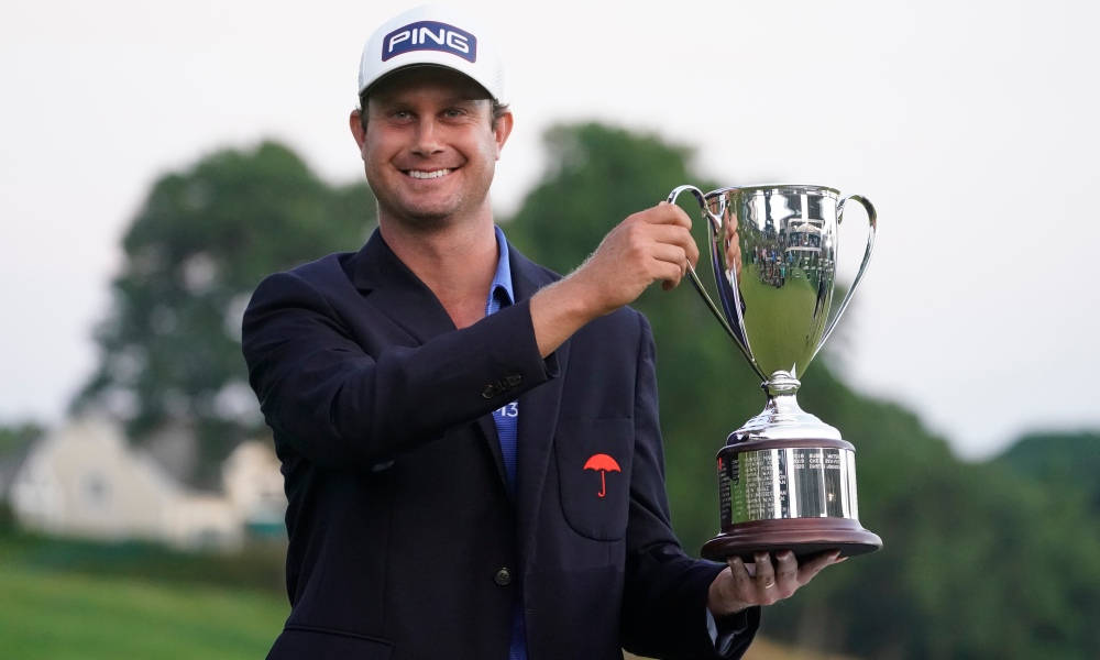 Harris English Holding A Trophy