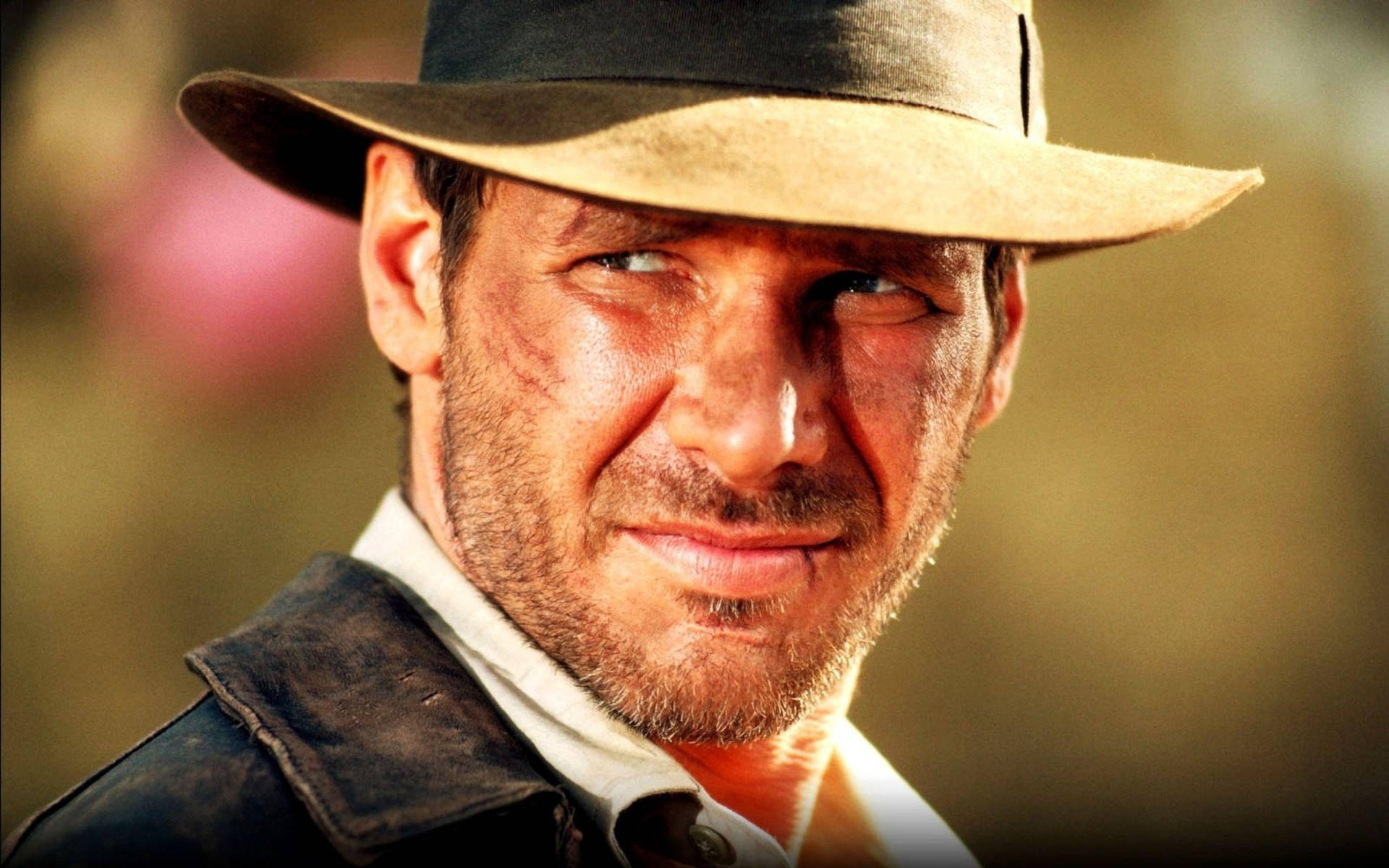 Harrison Ford As Indiana Jones In Classic Action Adventure Background