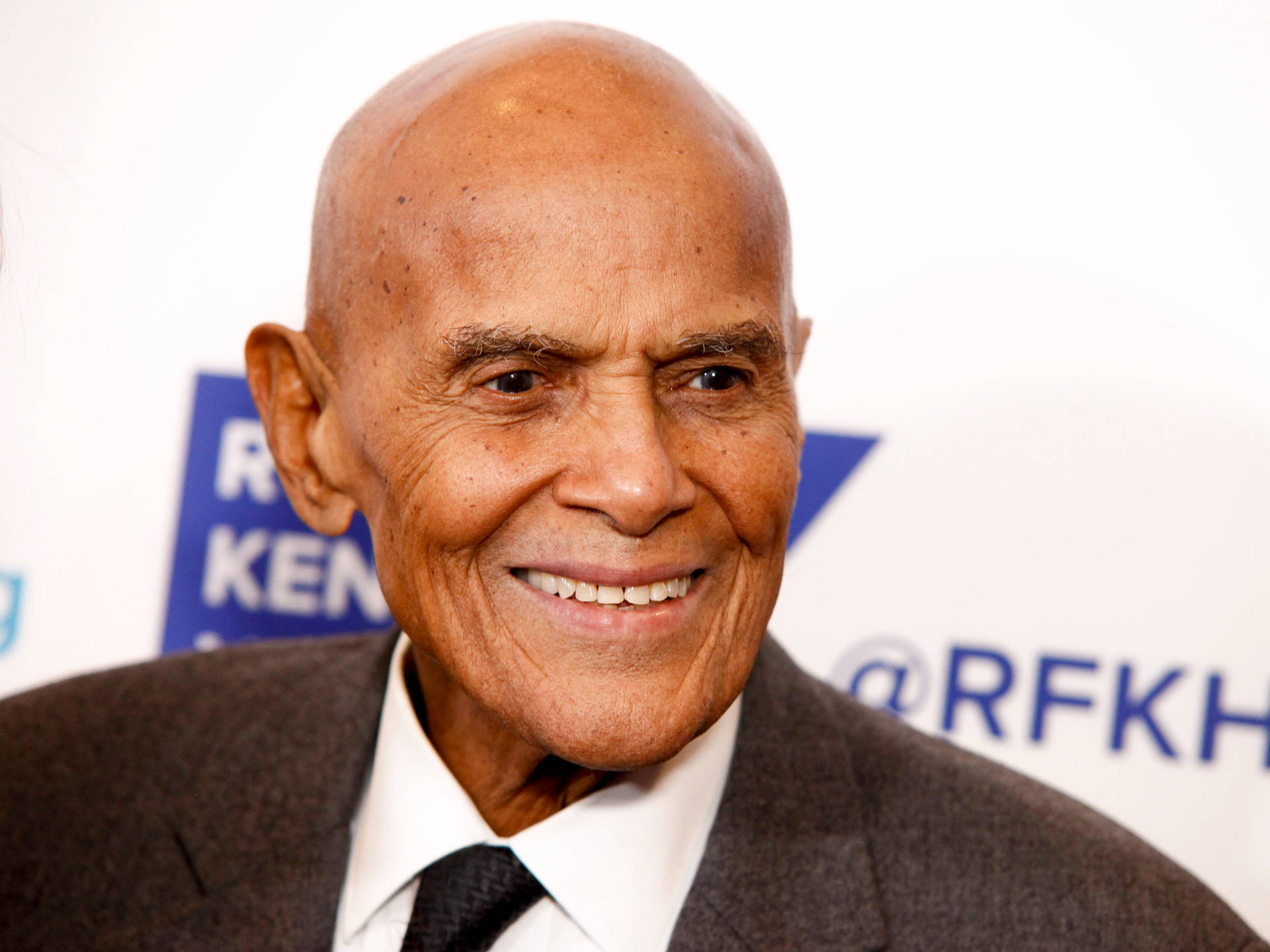 Harry Belafonte Smiling Entertainer Background