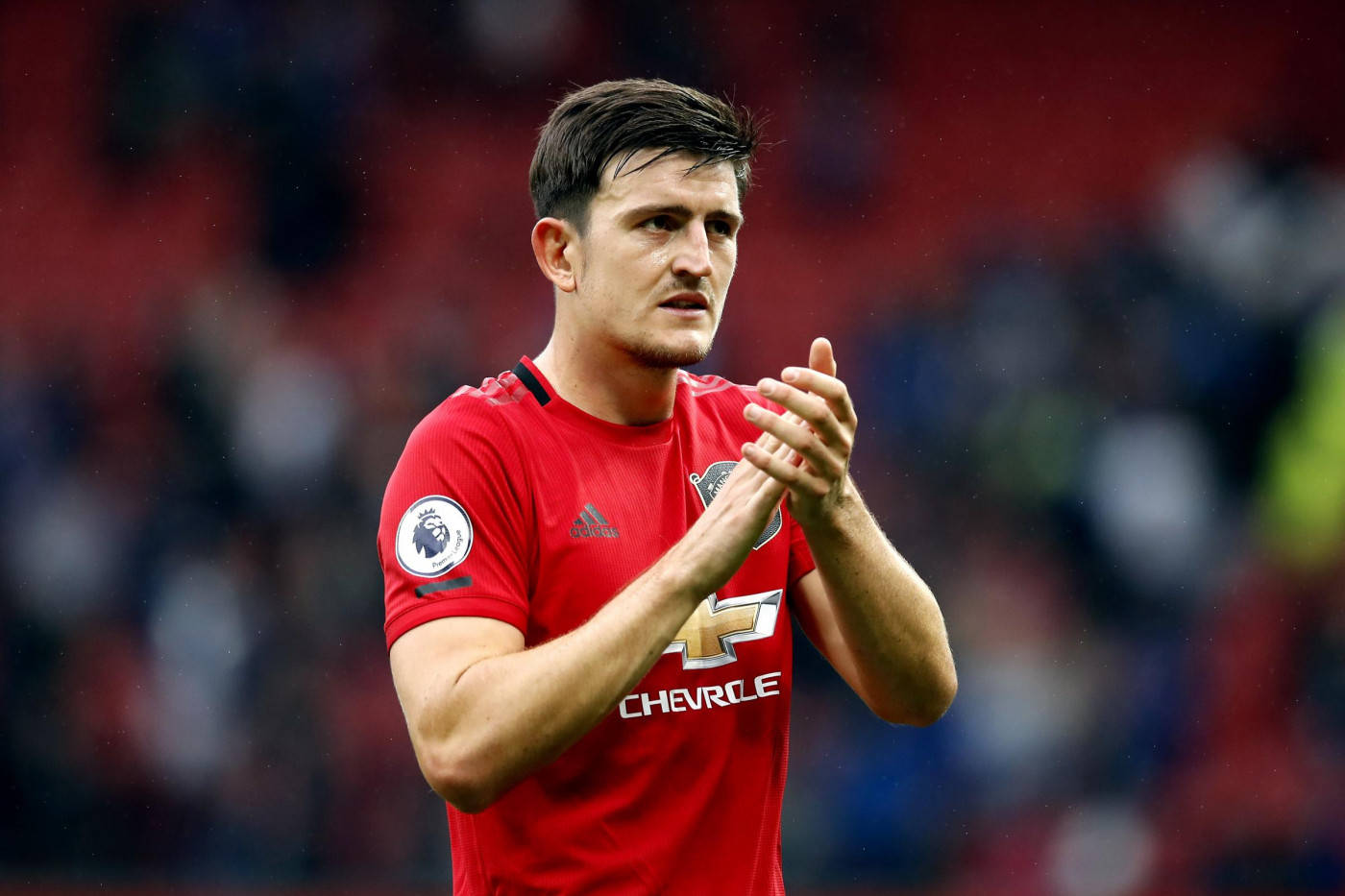 Harry Maguire Clapping In A Match Background