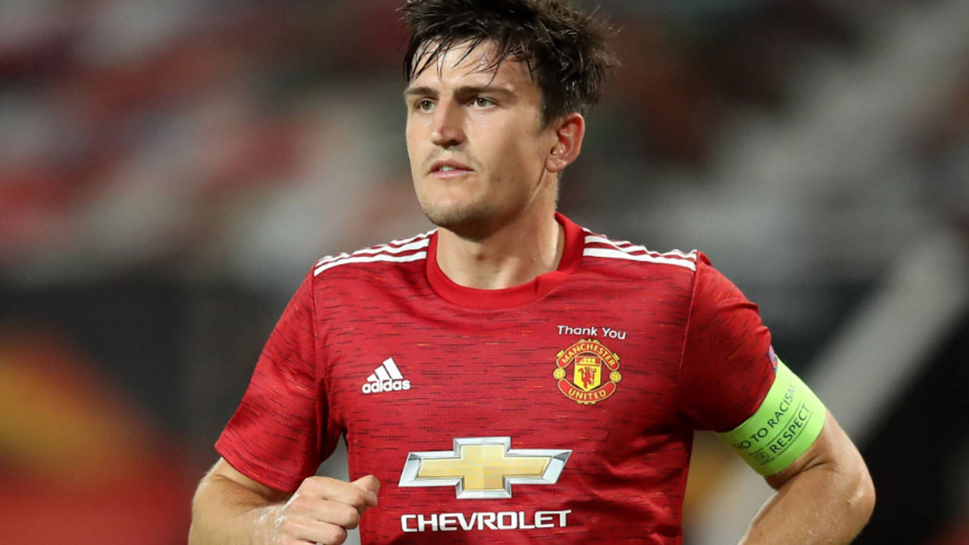 Harry Maguire Running With A Red Uniform