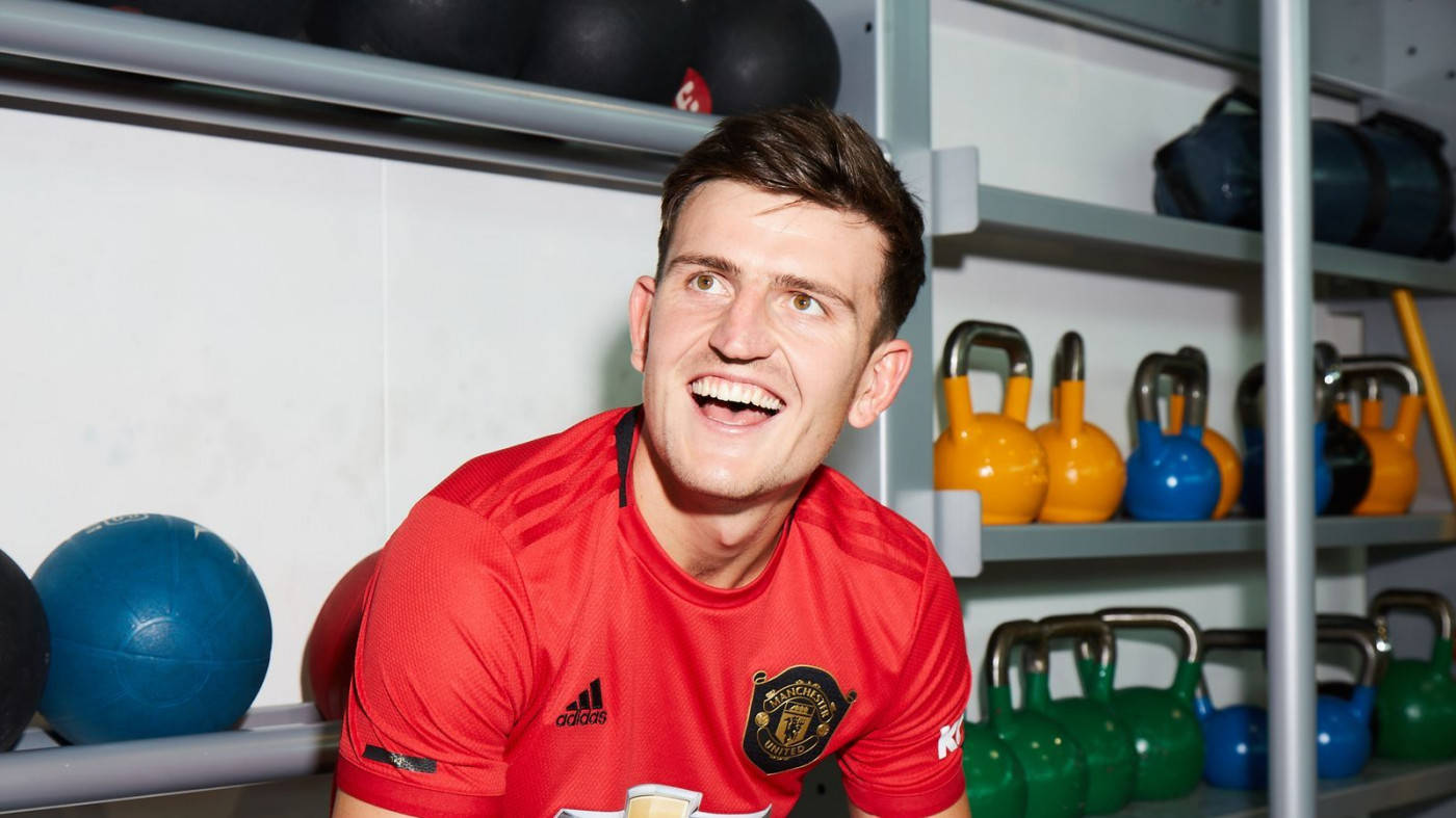 Harry Maguire Smiling And Looking Towards The Side Background