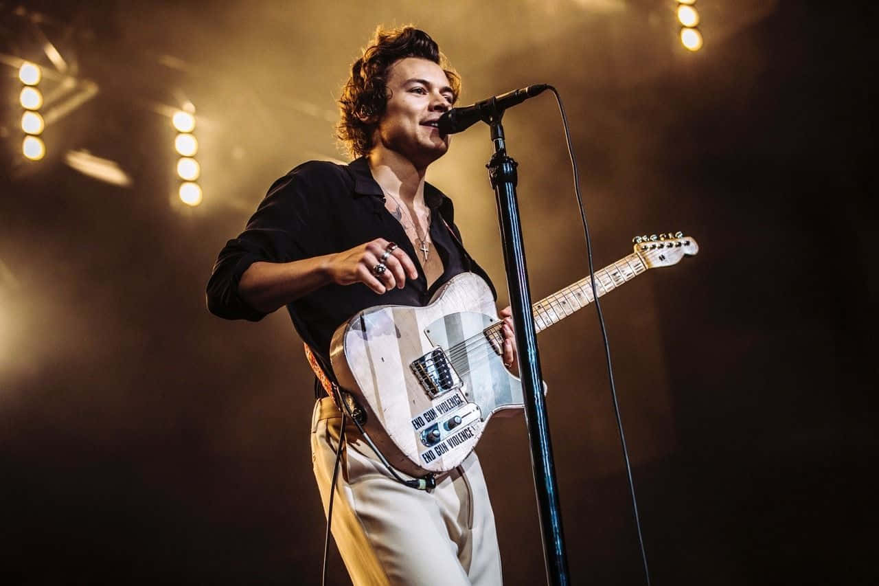 Harry Styles Uses His Laptop To Create Memorable Music.