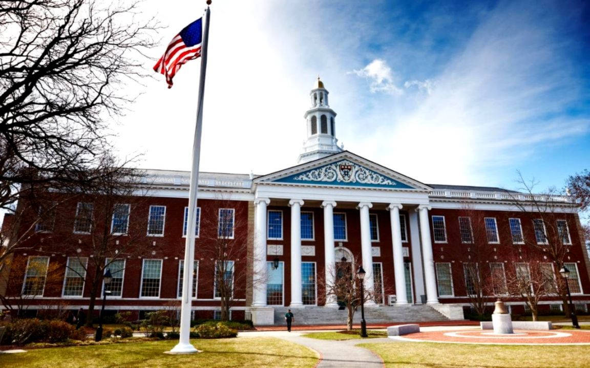 Harvard University With Waving Us Flag Background