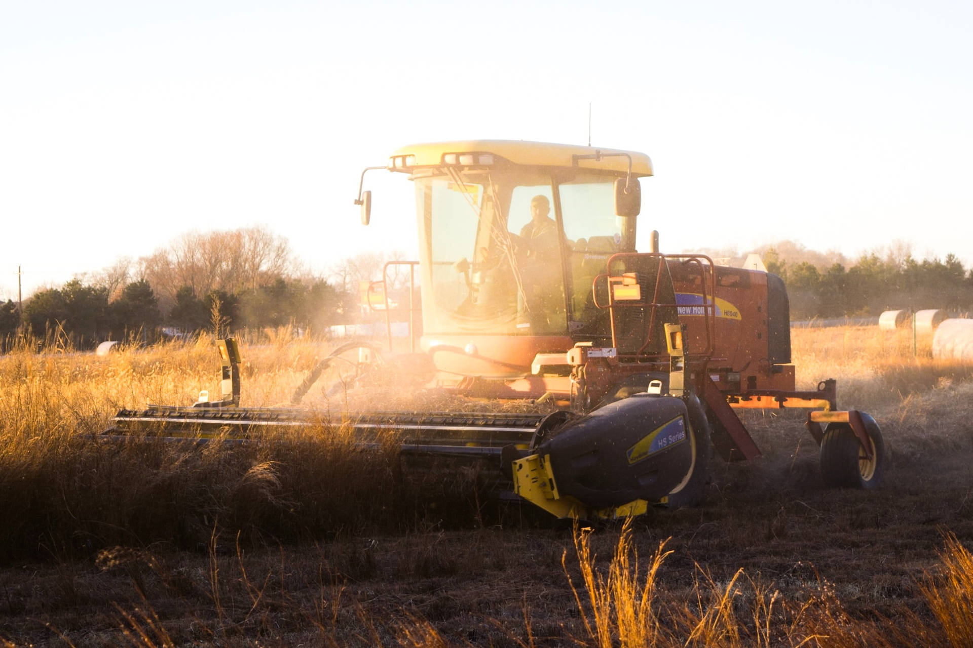 Harvesting Farm Cereals With Yellow Combine Harvester