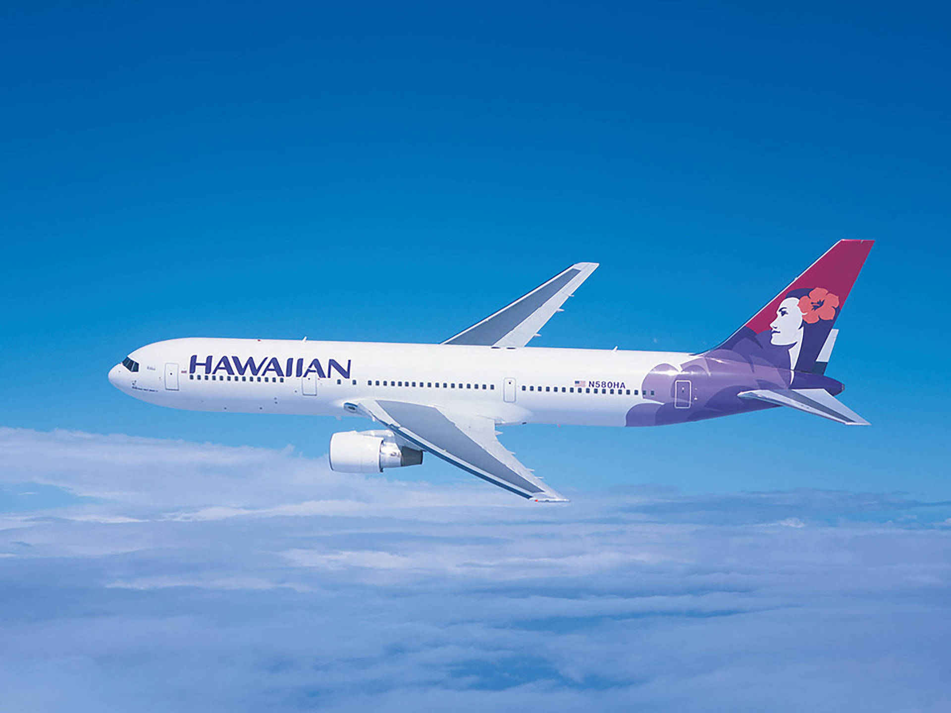 Hawaiian Airlines Navigating On The Sky Background