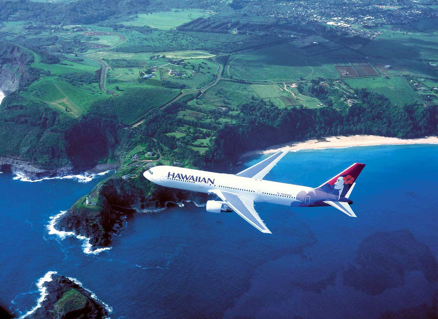 Hawaiian Airlines Plane Above Sublime Waters Background