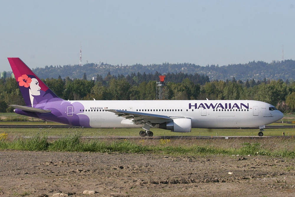 Hawaiian Airlines Plane On Runway Background