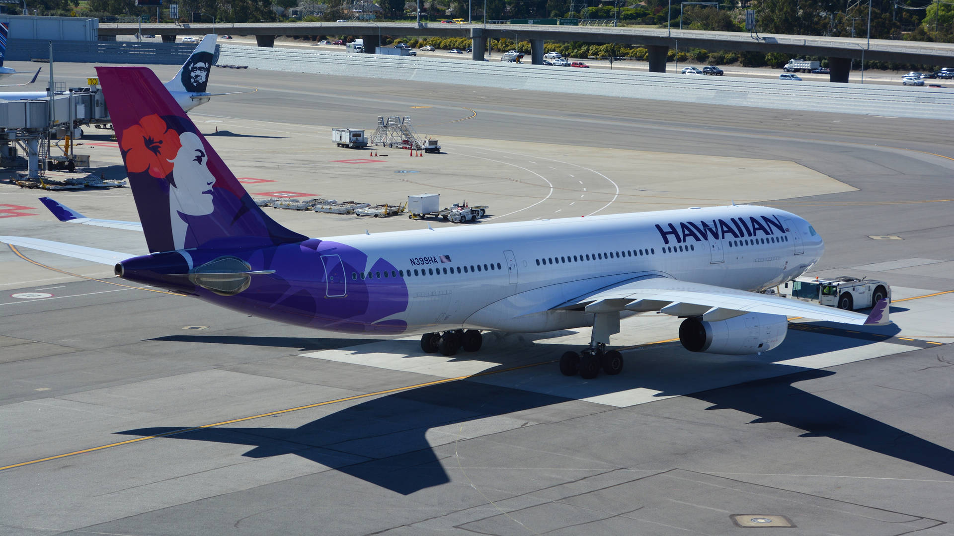 Hawaiian Airlines Plane On The Runway Background