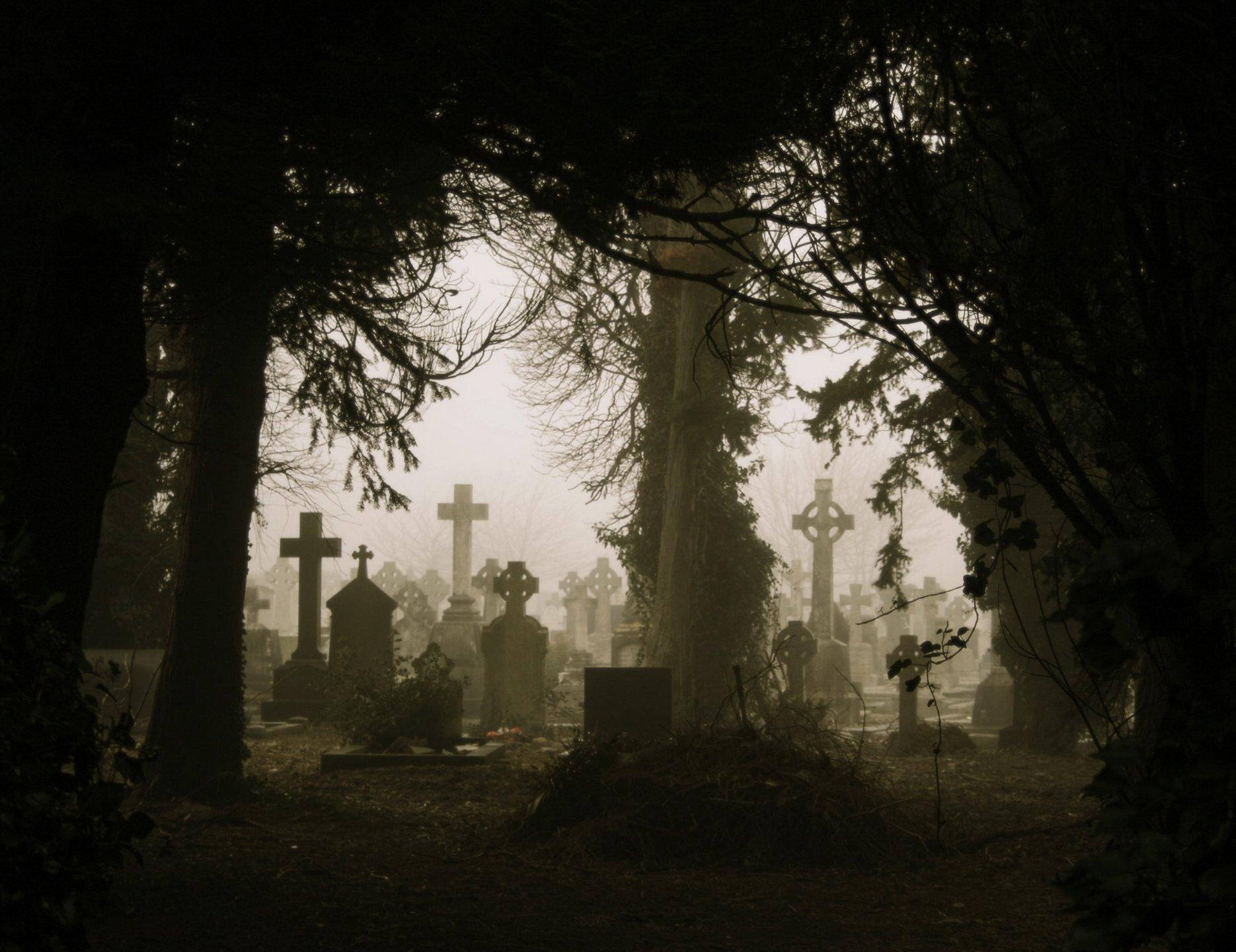 Hazy Graveyard Silhouette Background