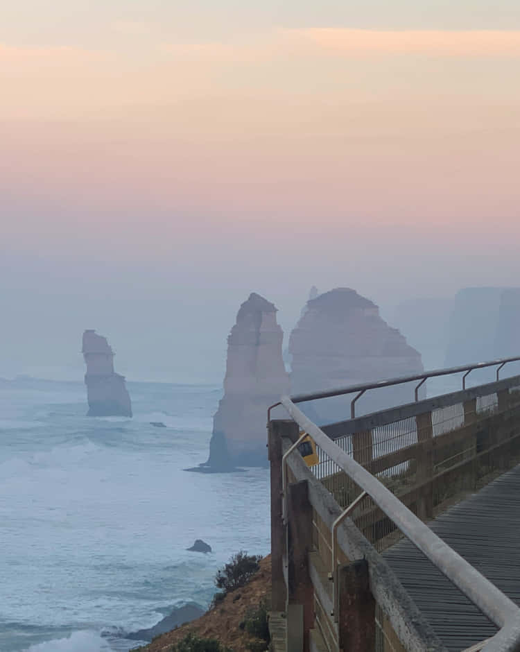 Hazy Great Ocean Road With Twelve Apostles In Australia Background