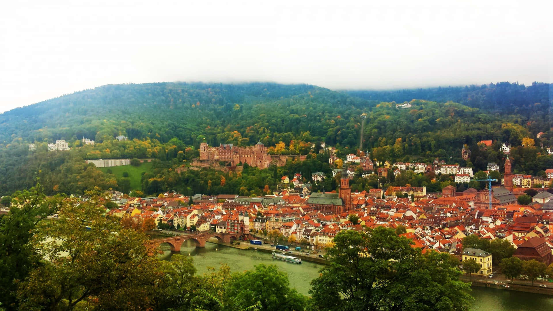 Hazy View Of Heidelberg Castle Background