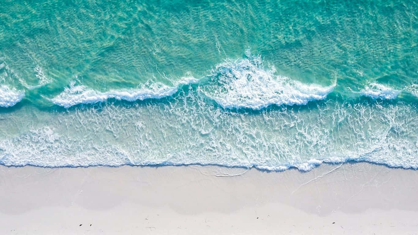 Hd Beach With Foamy Waves Aerial View Background