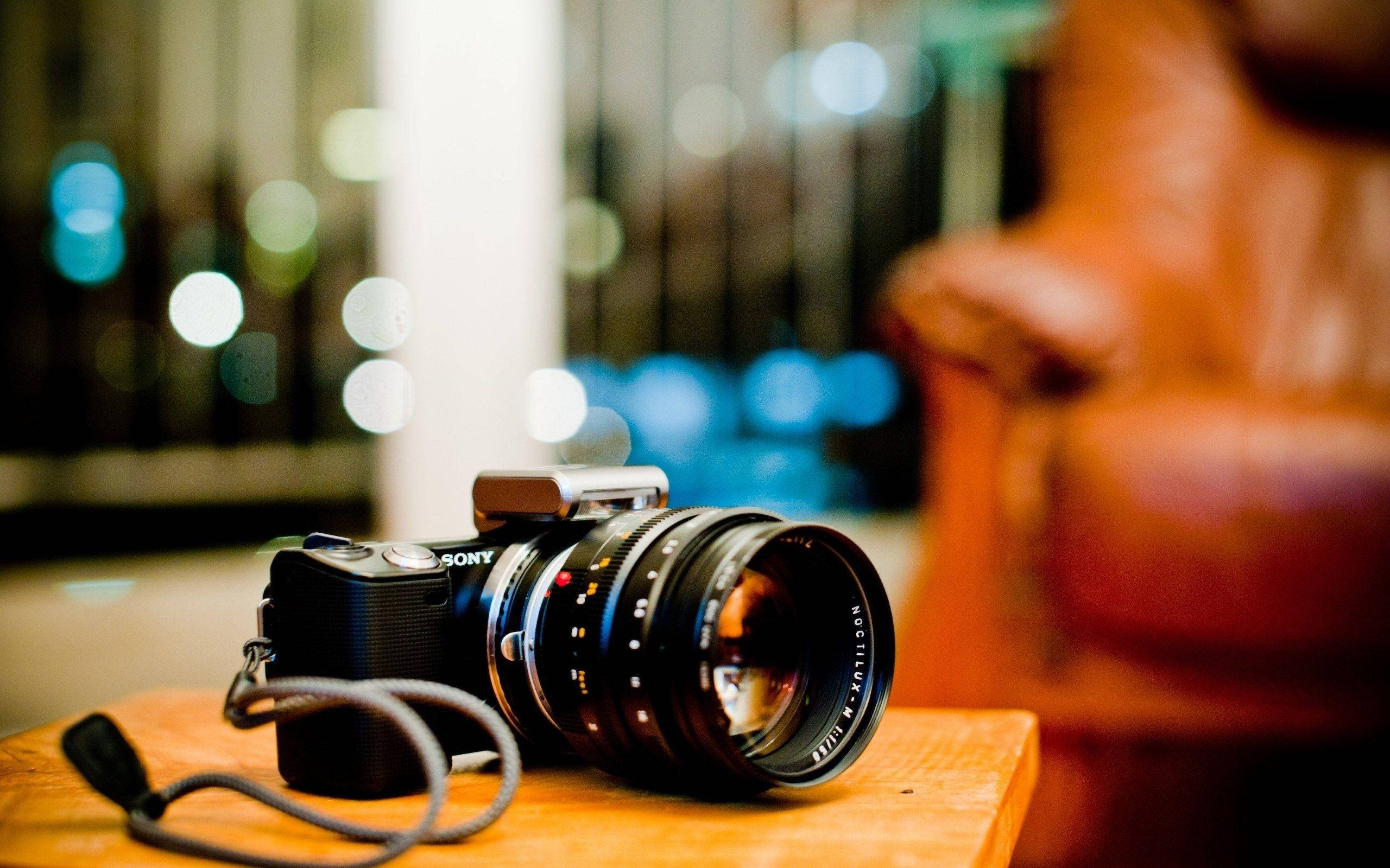 Hd Camera On A Wooden Table Background