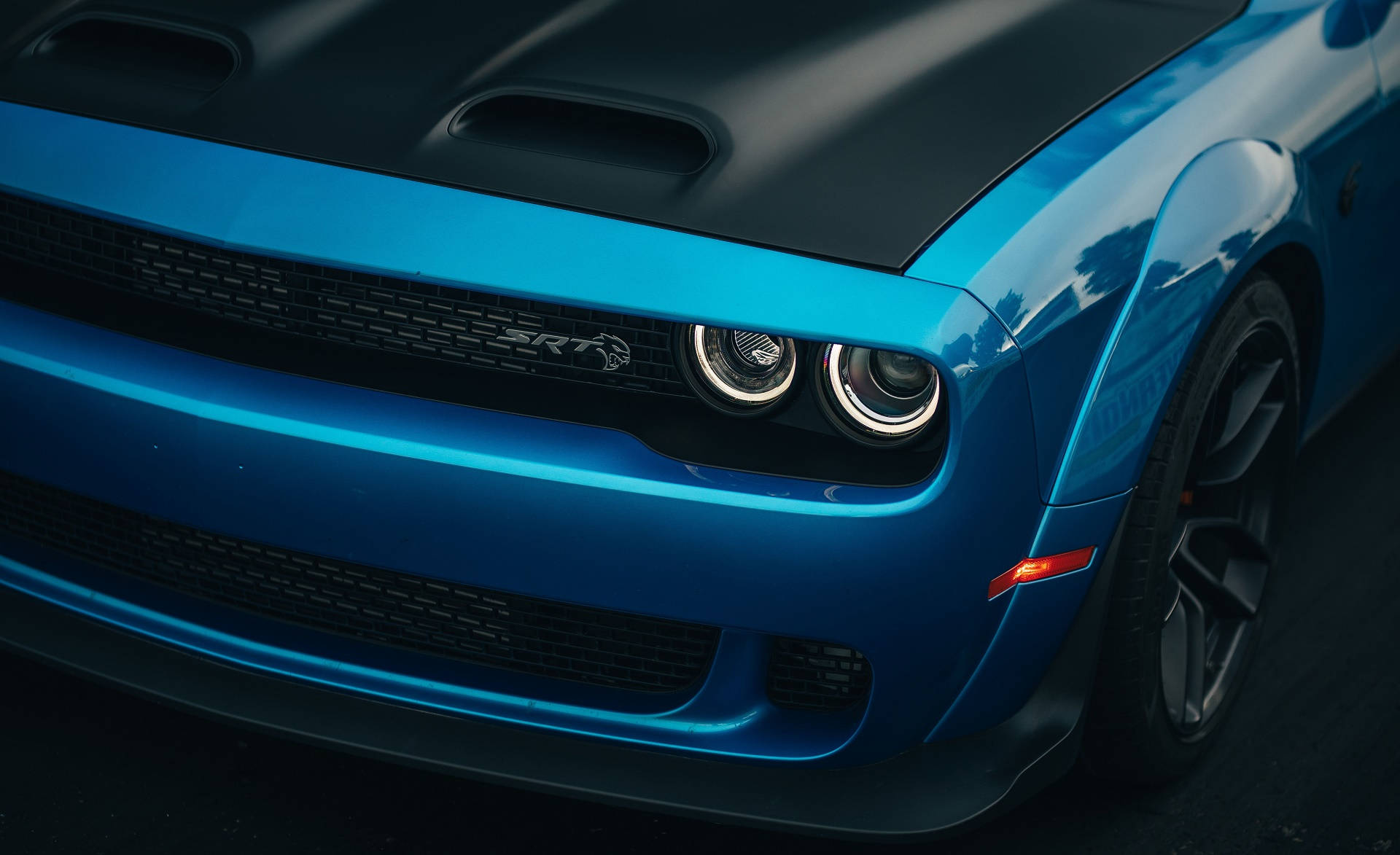 Headlights Of A Blue Dodge Challenger Background