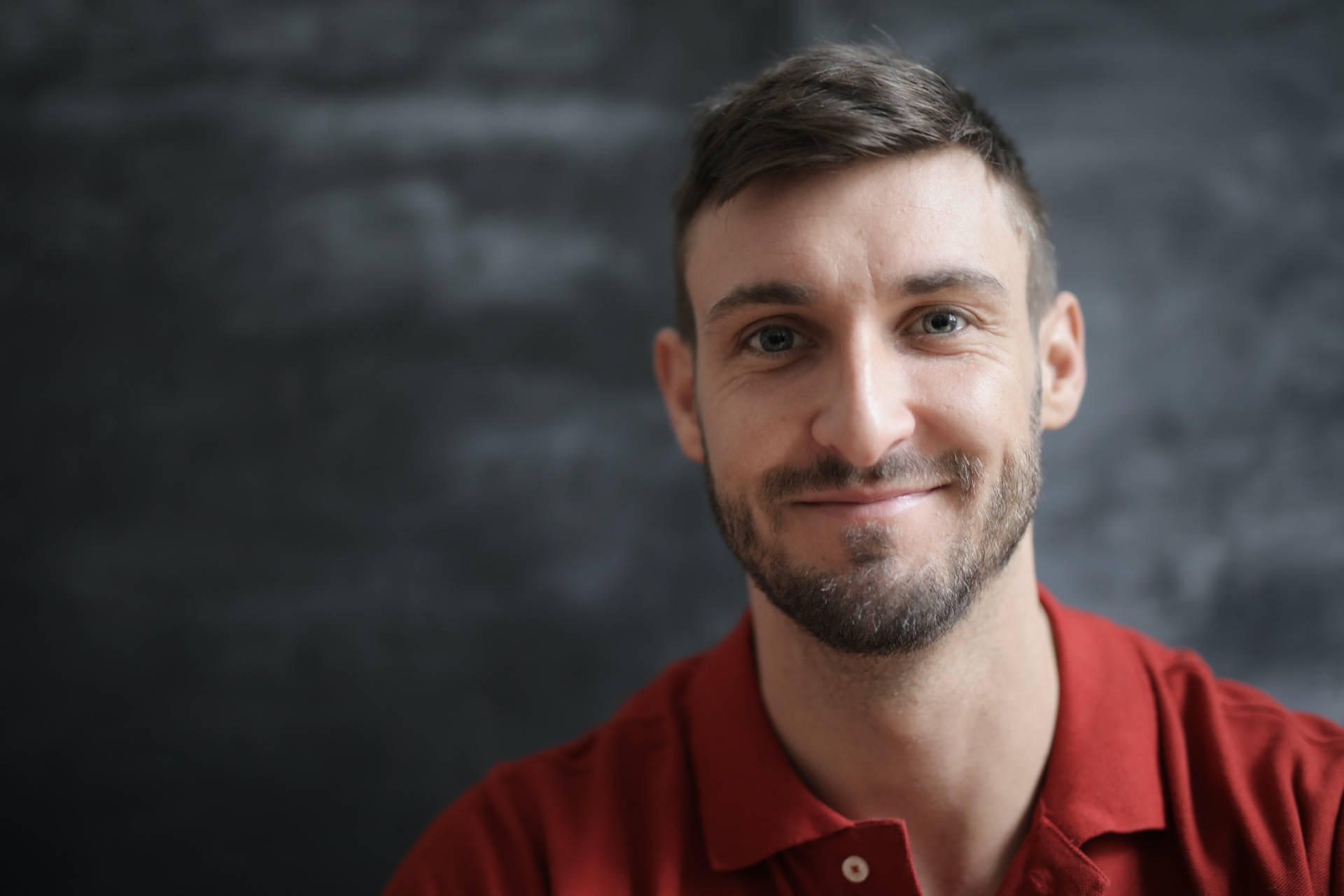 Headshot Of A Man In Red Background