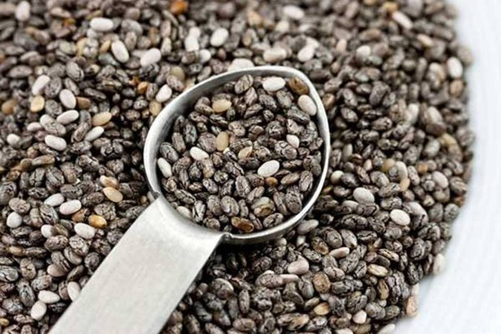 Healthy Chia Seeds In A Steel Measuring Spoon Background