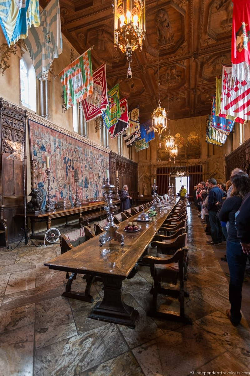 Hearst Castle's Dining Room With Visitors Background