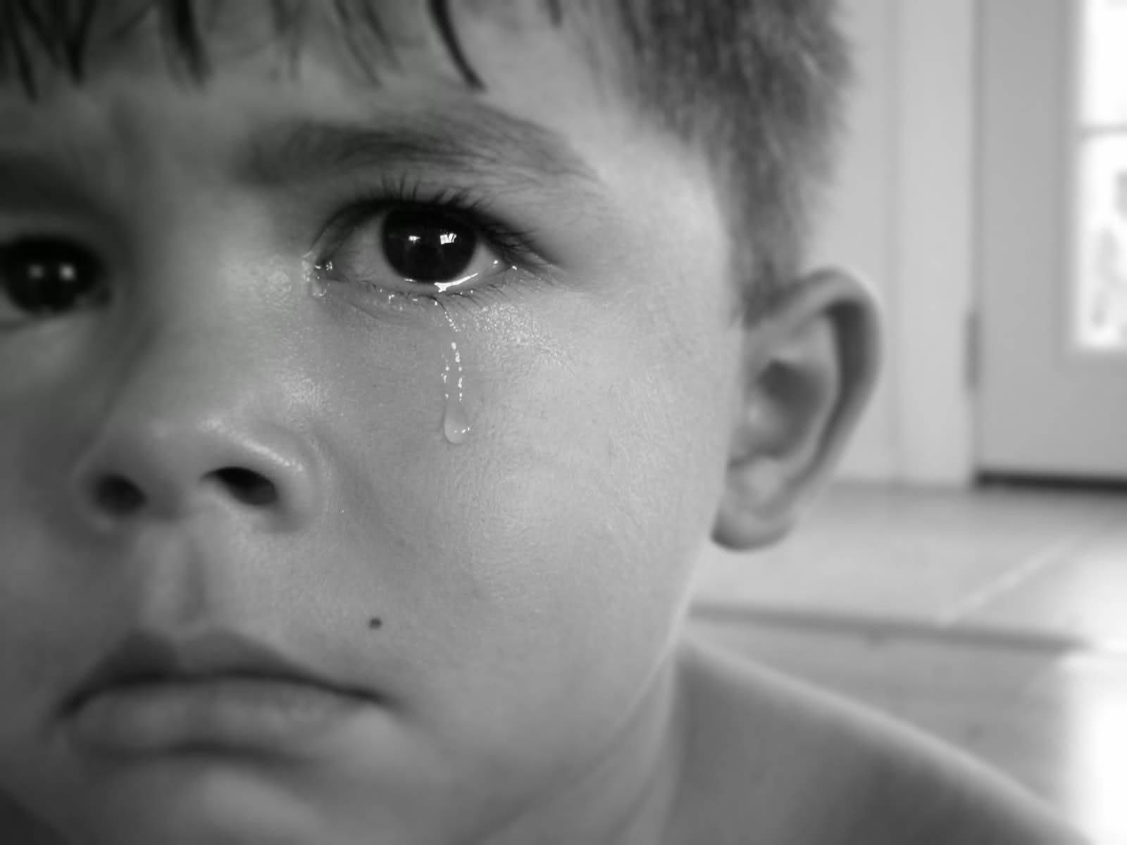 Heartbroken Boy Overwhelmed With Emotions Background