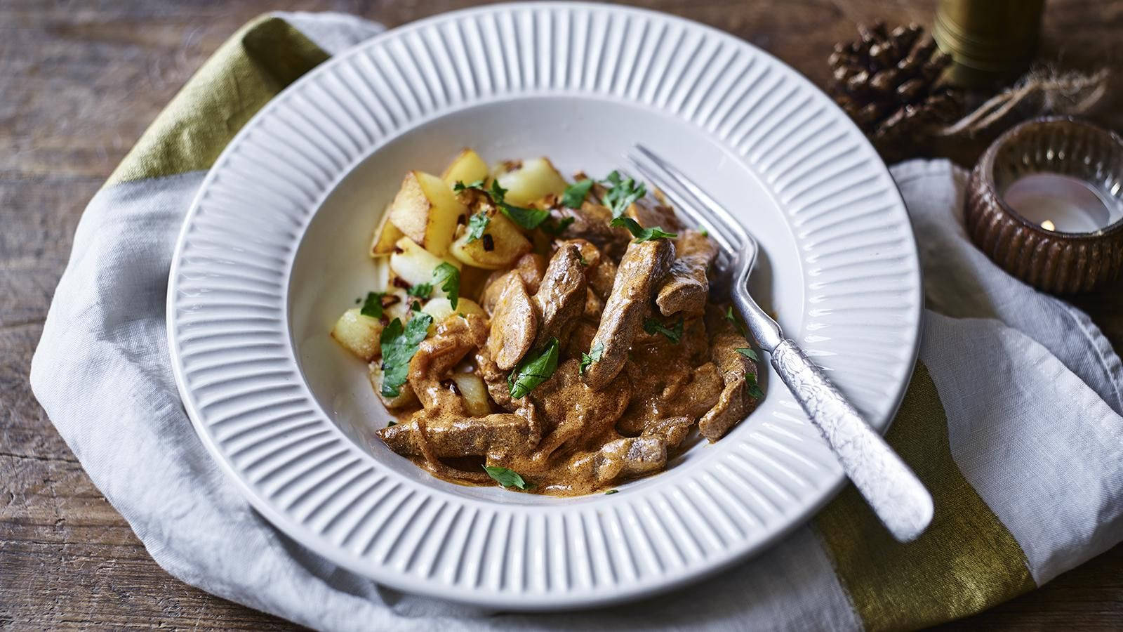 Hearty Homemade Beef Stroganoff With Steamed Potatoes Background