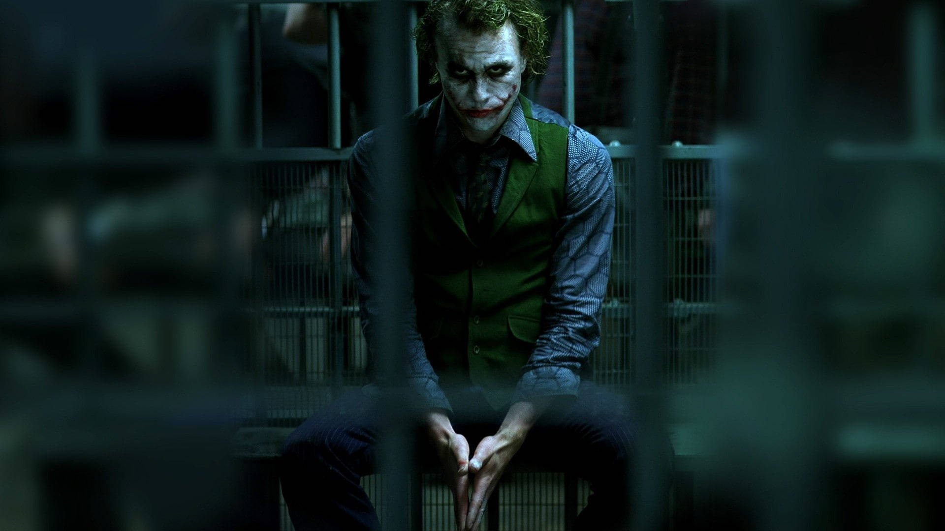 Heath Ledger Joker Behind Bars Background