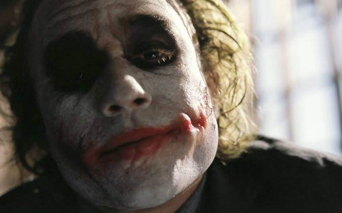 Heath Ledger's Iconic Sad Joker Portrayal Background