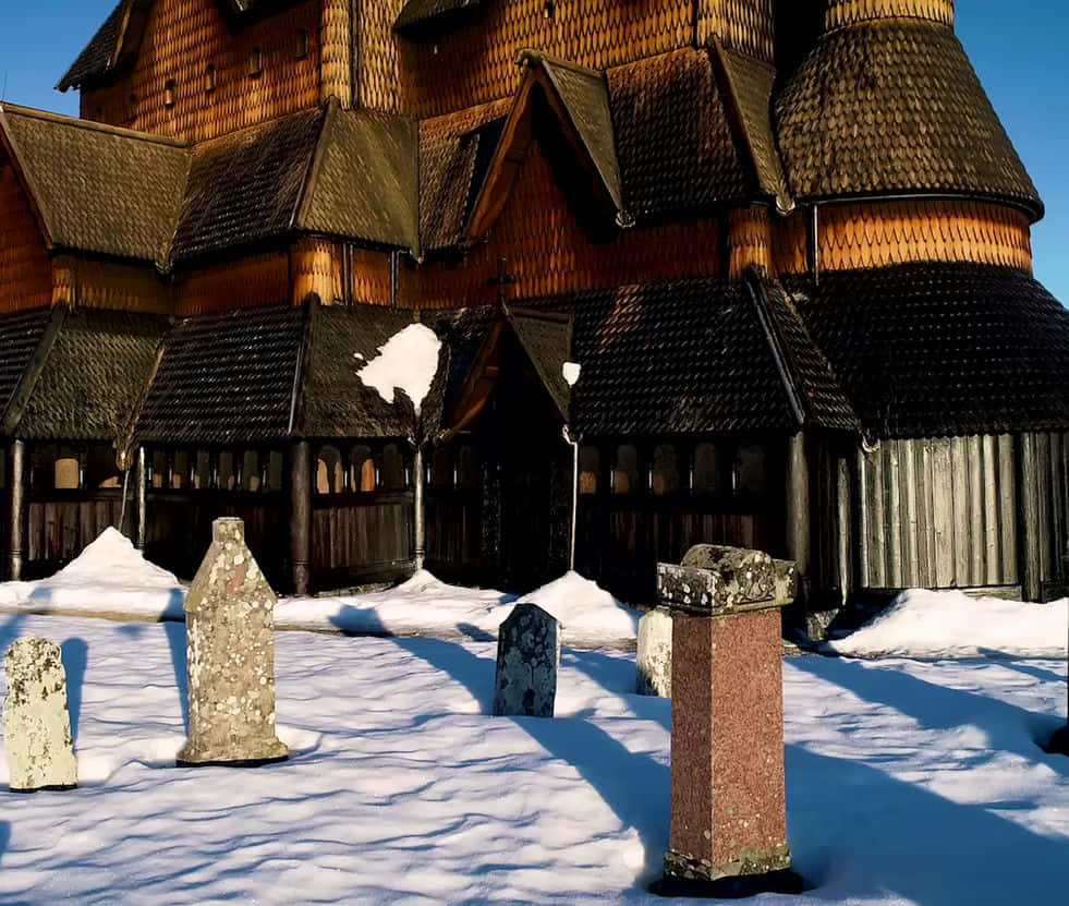 Heddal Stave Church Graveyard With Snow Background