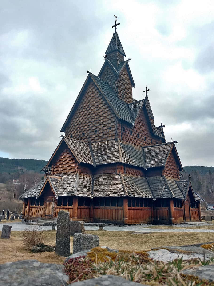 Heddal Stave Church Under White Clouds Background