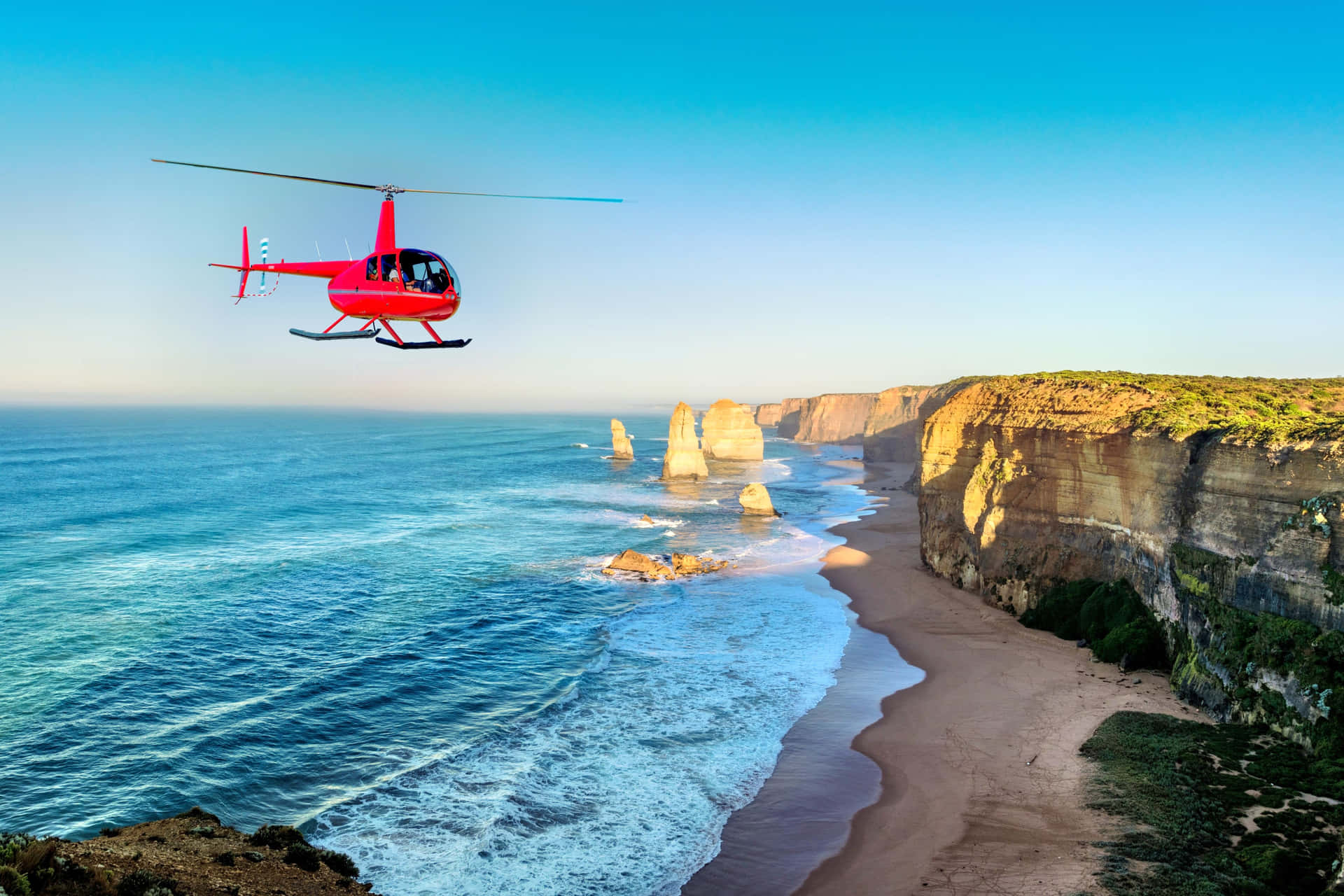 Helicopter In Twelve Apostles In Victoria Australia Background