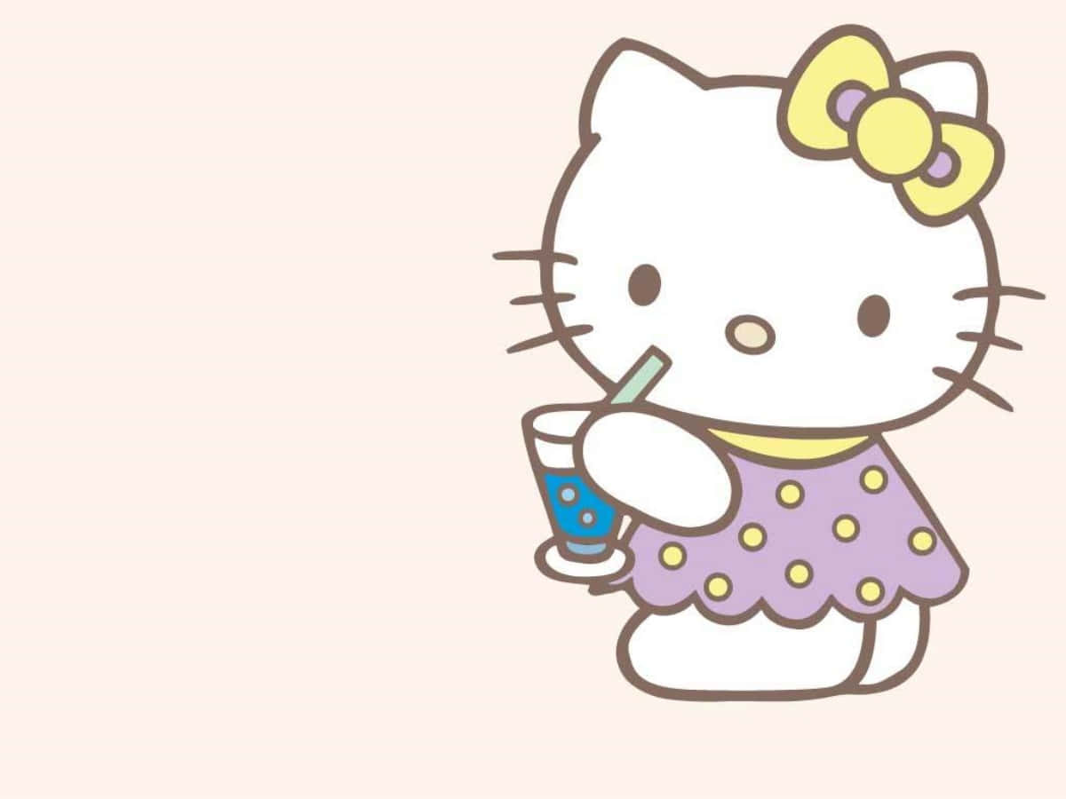 Hello Kitty Laptop Sipping Drink