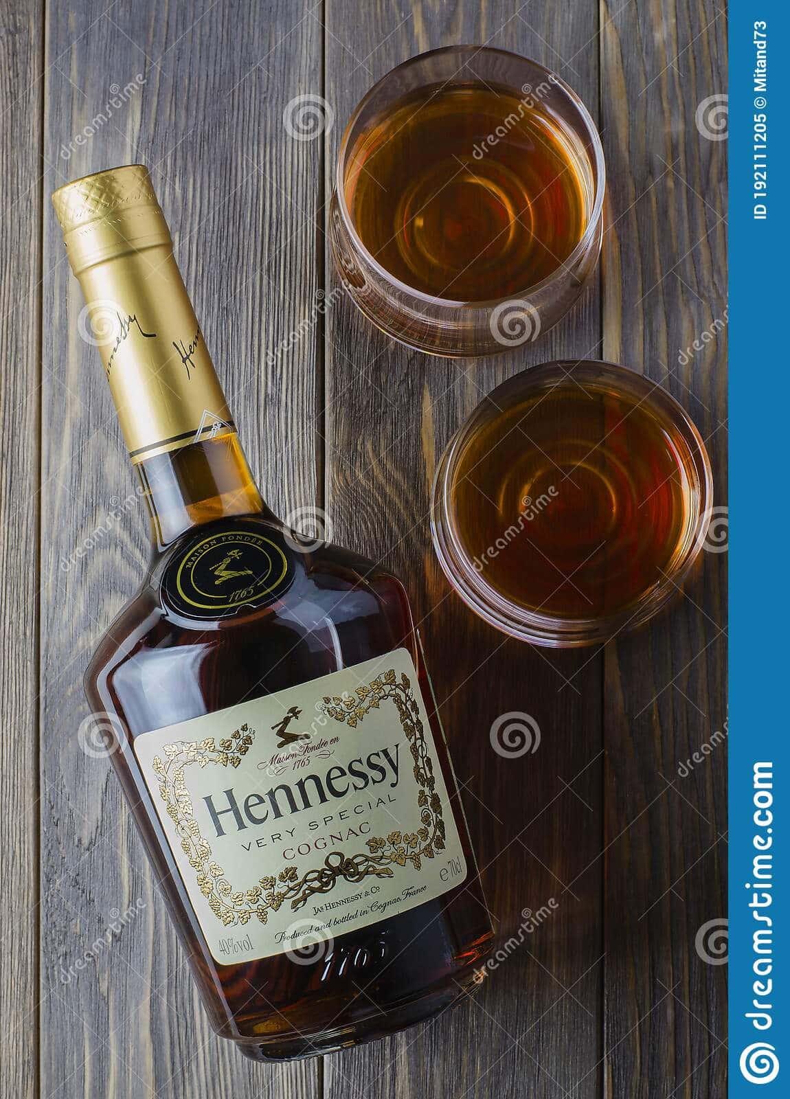 Hennessy Whiskey Bottle And Glasses On Wooden Background Background