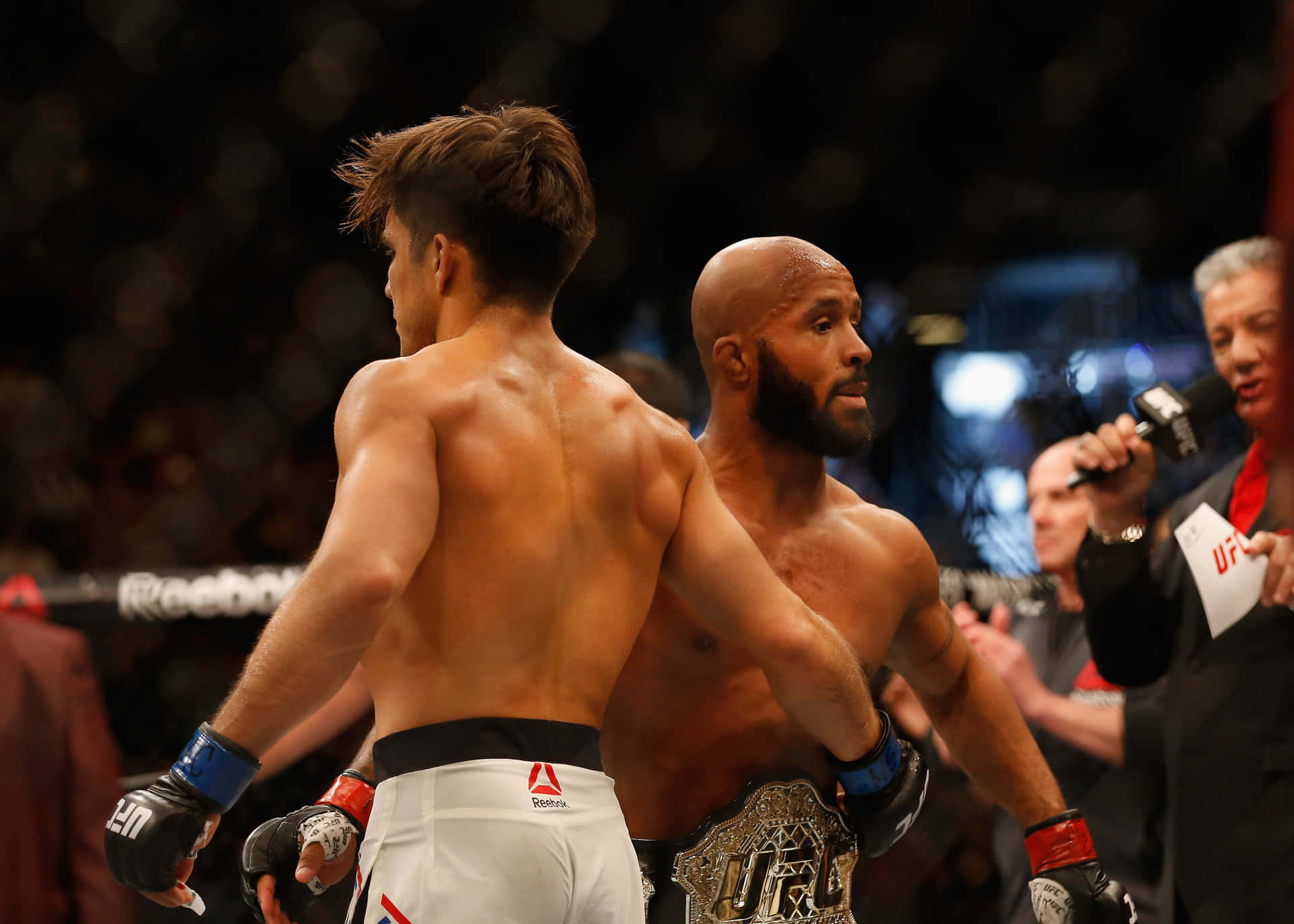 Henry Cejudo And Demetrious Johnson After Match Background