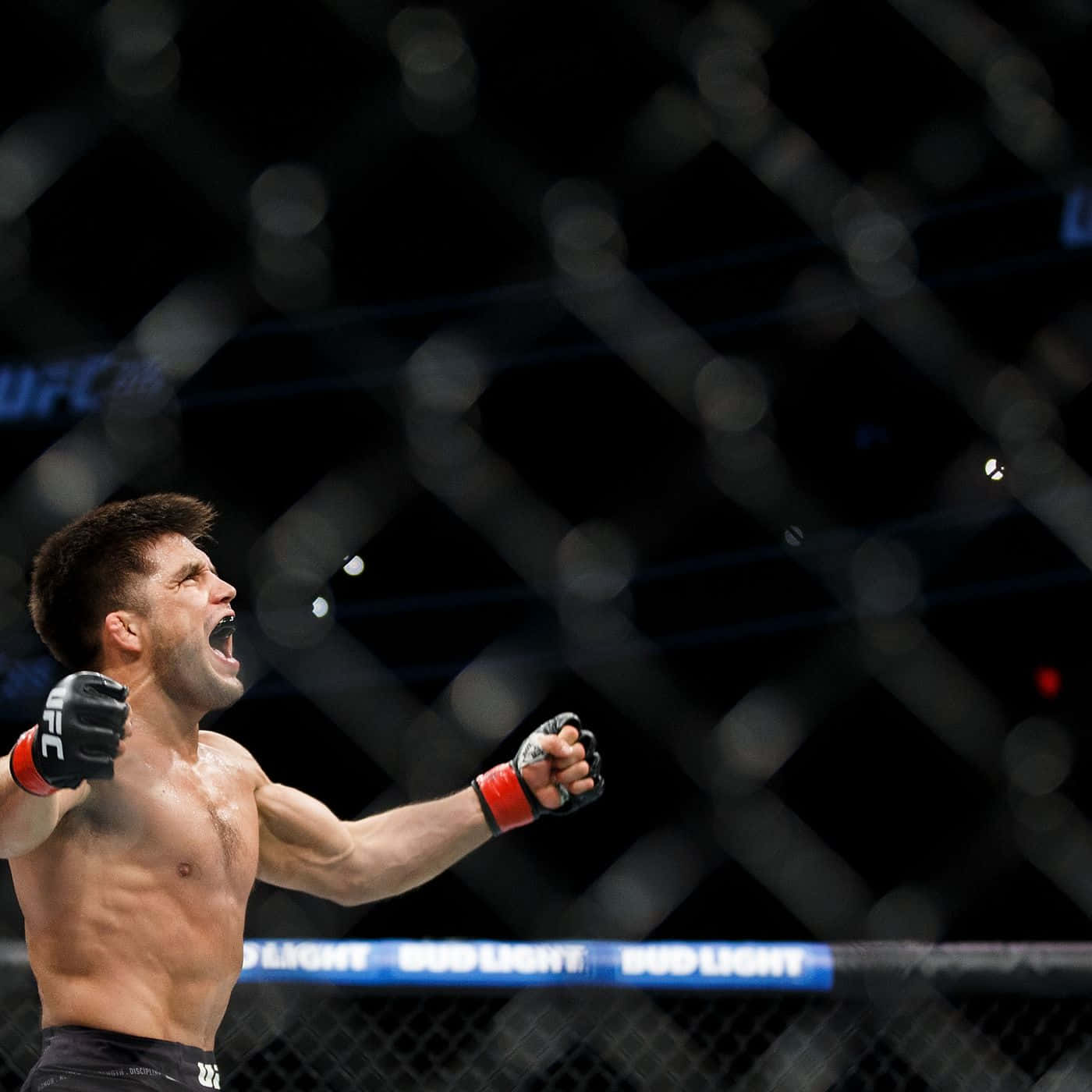 Henry Cejudo Celebrating Victory Over Tj Dillashaw Background
