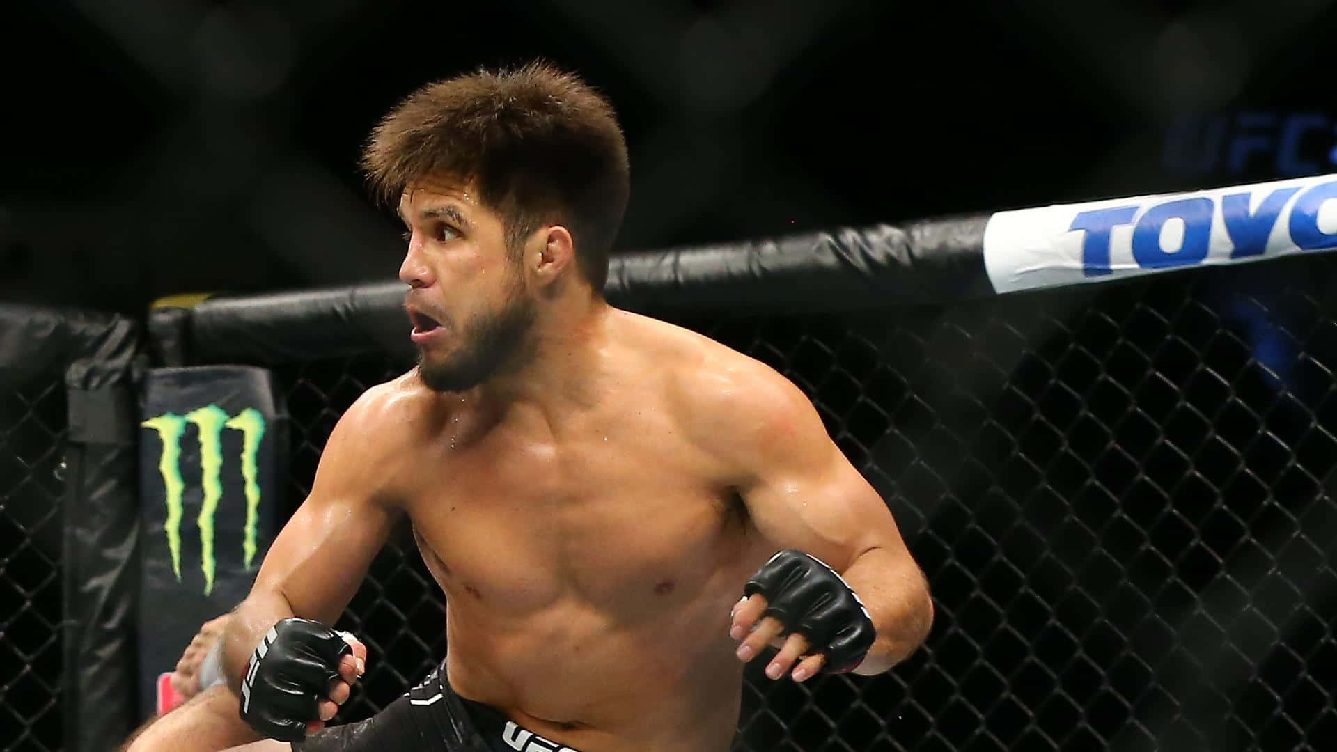 Henry Cejudo In Vystar Veterans Memorial Arena Background