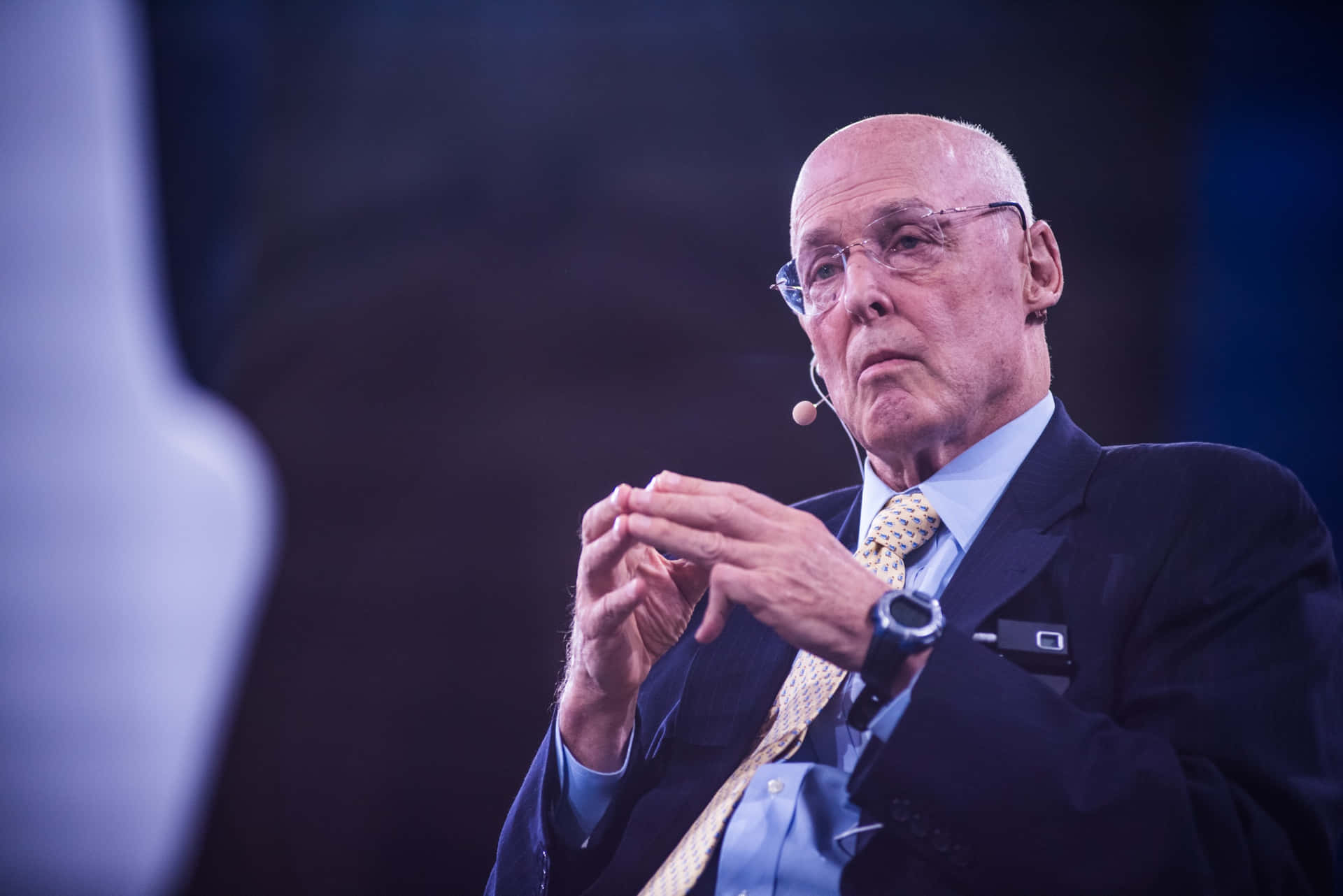 – Henry Paulson In A Poised And Confident Stance Background