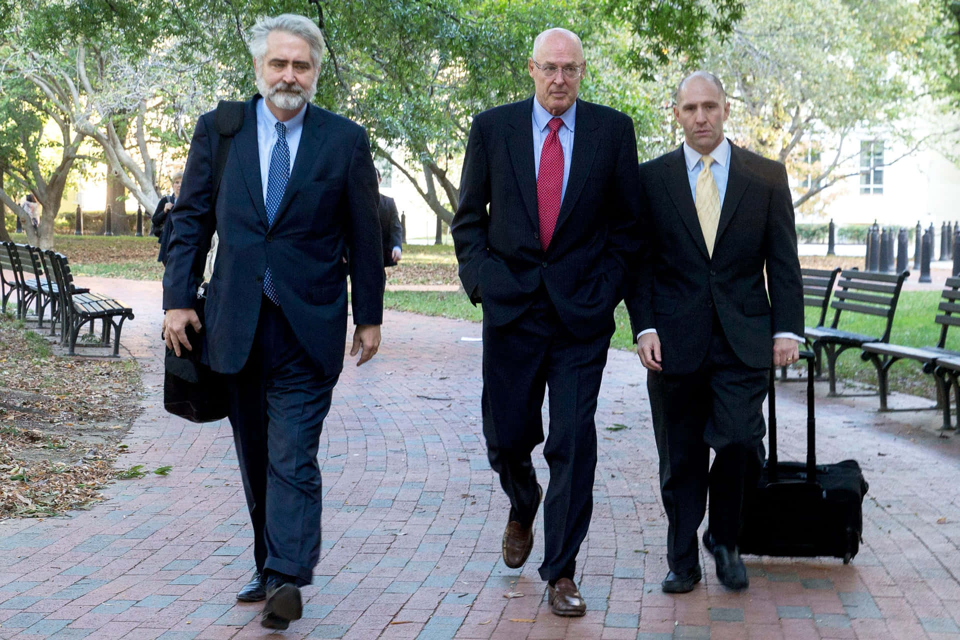 Henry Paulson Walking With Assistants