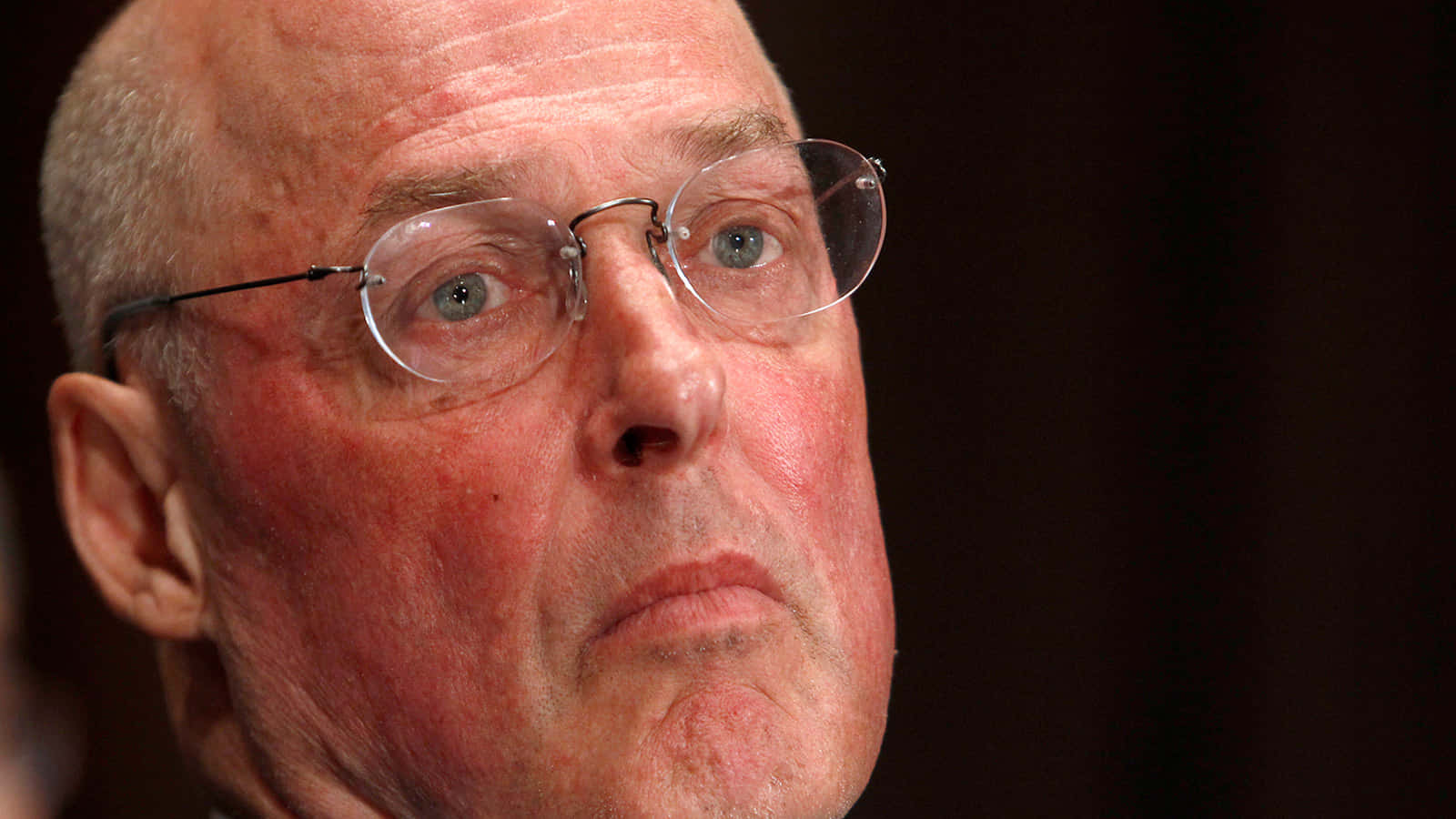 Henry Paulson With A Serious Expression Background