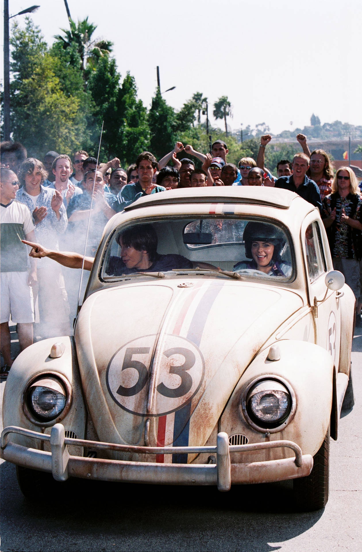 Herbie Fully Loaded Driving Couple In Crowd Background