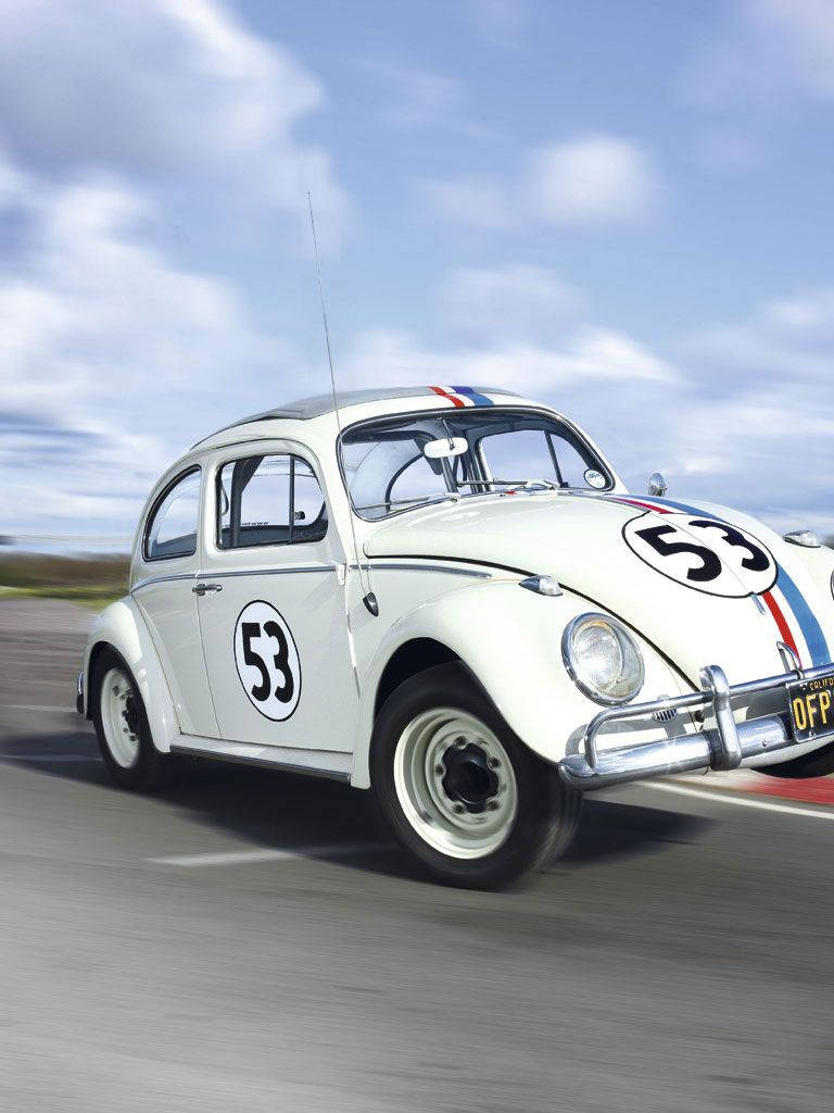 Herbie Fully Loaded Speeding On Racetrack Background