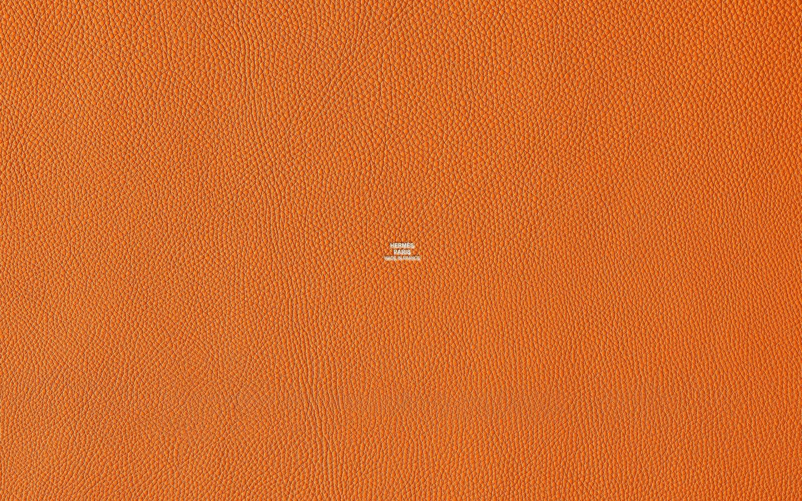 Hermes Logo On Textured Orange Background