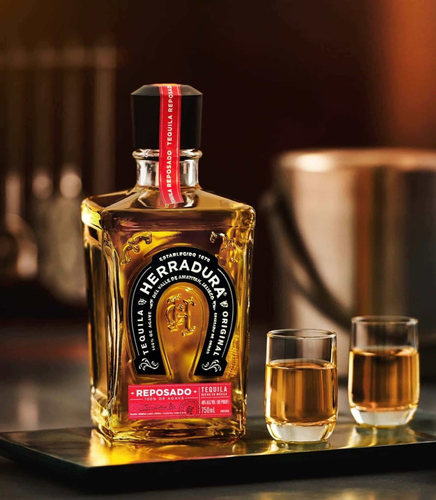 Herradura Reposado Tequila Bottleand Glasses Background