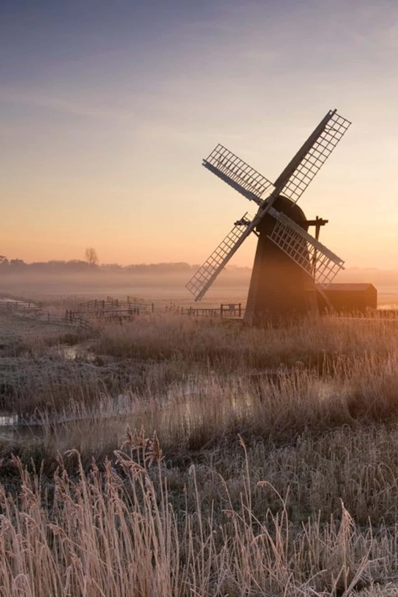 Herringfleet Windmill On A Sunset At The Norfolk Broads Background