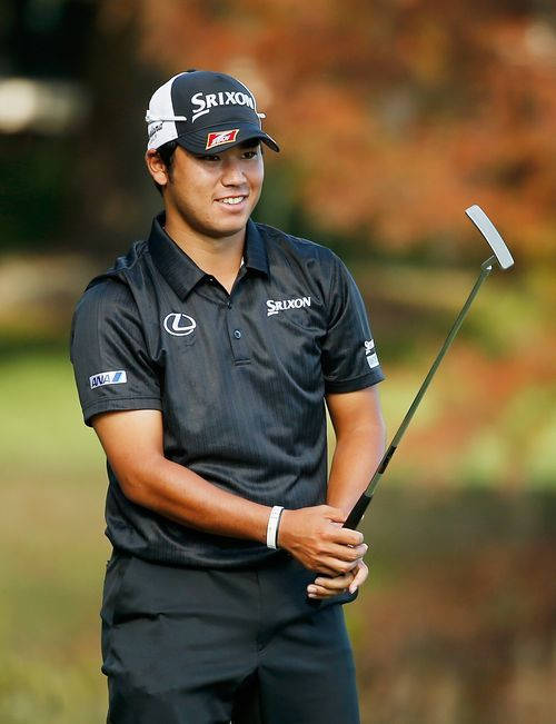 Hideki Matsuyama Grasping Golf Putter Background